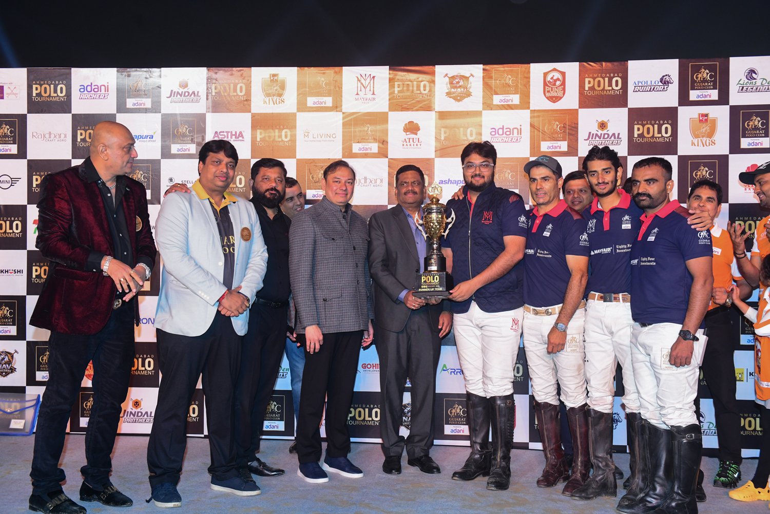 Dr. K. L. N. Rao, IPS, presents the Runner-Up Award to Shri Anay Mehta of the Mayfair Polo Team in the esteemed presence of Shri Pranav Adani. - Gujarat Polo Club Season 1